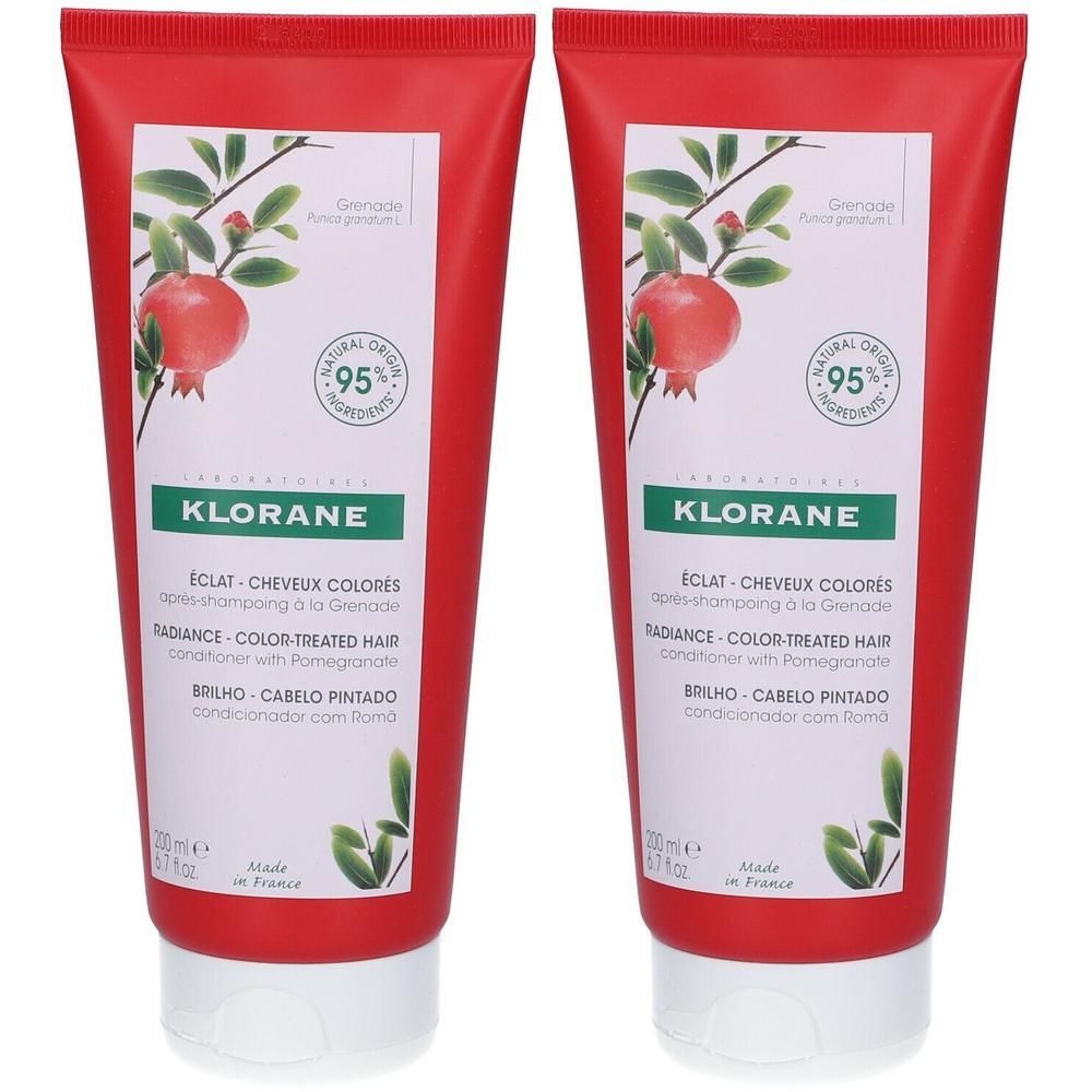 Twee rode tubes Klorane conditioner. Illustratie van granaatappel, 95% natuurlijke ingrediënten. Tekst: Éclat Cheveux Colorés.