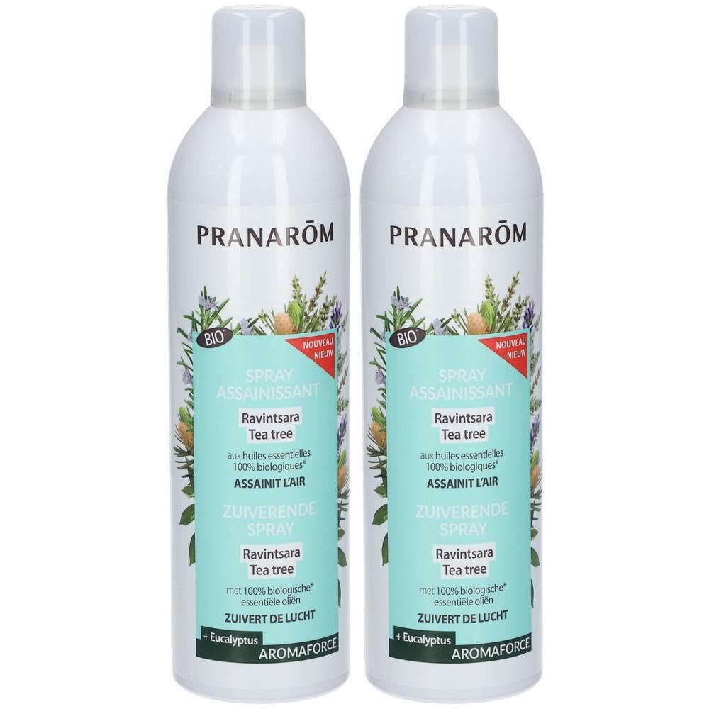Twee witte sprayflessen met etiketten. Opschrift: PRANARÔM, Spray assainissant, Ravintsara Tea tree, BIO.