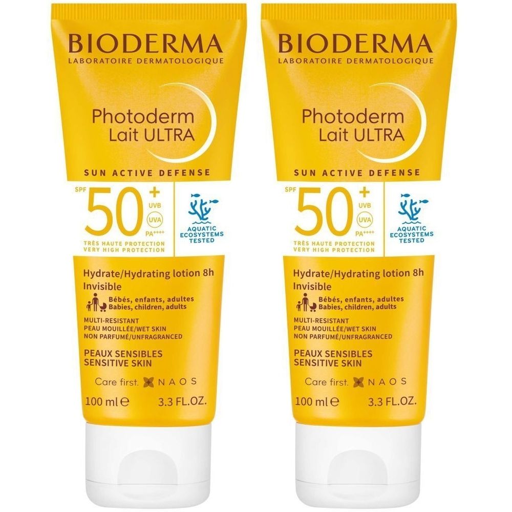 Deux tubes jaunes de crème solaire. Inscription: BIODERMA Photoderm Lait ULTRA SPF50+. Pour peaux sensibles.
