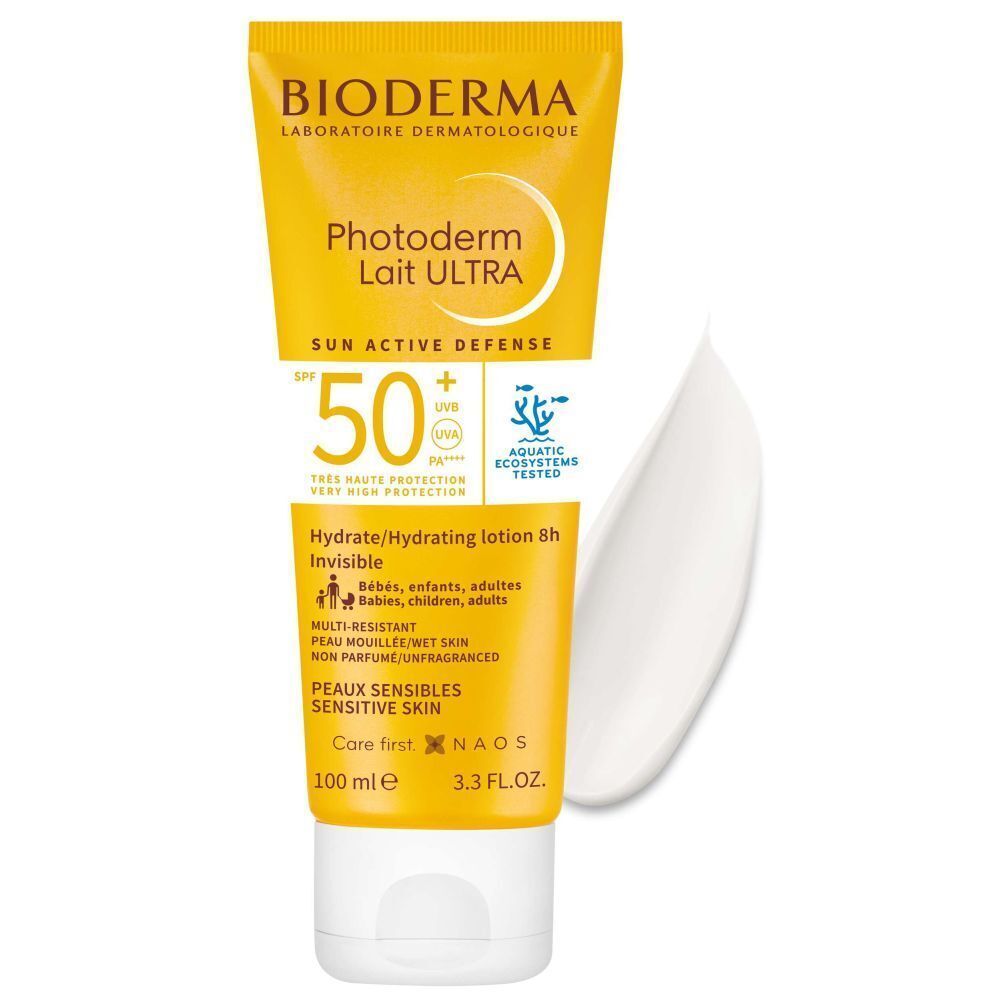 Tube de crème solaire avec coulée de crème. Tube jaune avec bouchon blanc. Inscription: BIODERMA Photoderm Lait Ultra SPF50+.