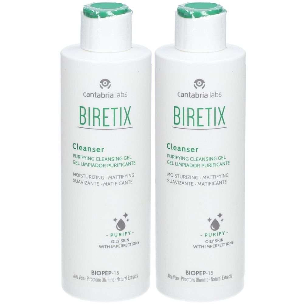 Twee witte flessen met groene dop. Opschrift BIRETIX Cleanser, tekst in meerdere talen. Voor onzuivere huid.