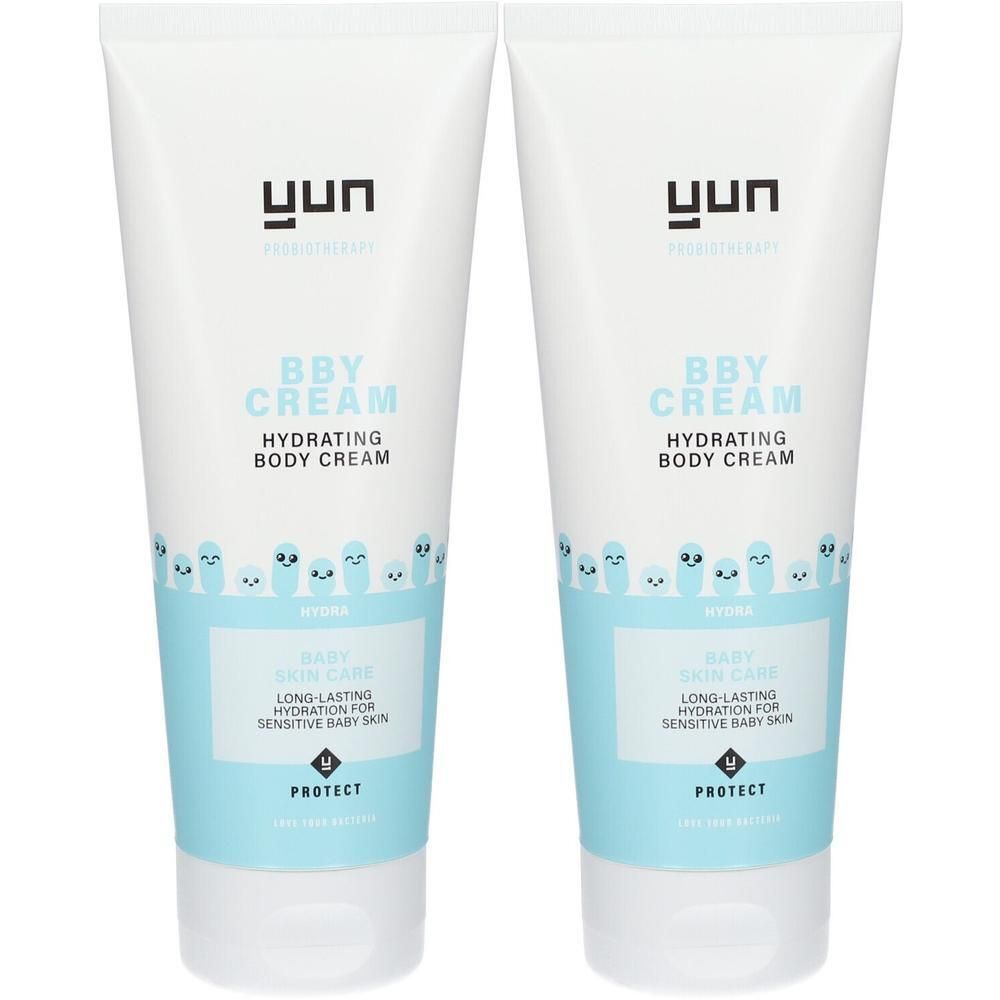 Twee tubes YUN BBY Hydra bodycrème. Witte tubes met blauw etiket. Opschrift: BBY CREAM, Hydrating Body Cream.