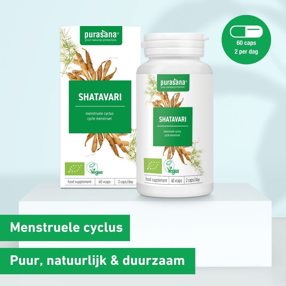 Verpakking en fles. Opschrift: SHATAVARI, vegan, 60 capsules, 2 capsules/dag. Merk: Purasana. Groen: Menstruele cyclus.