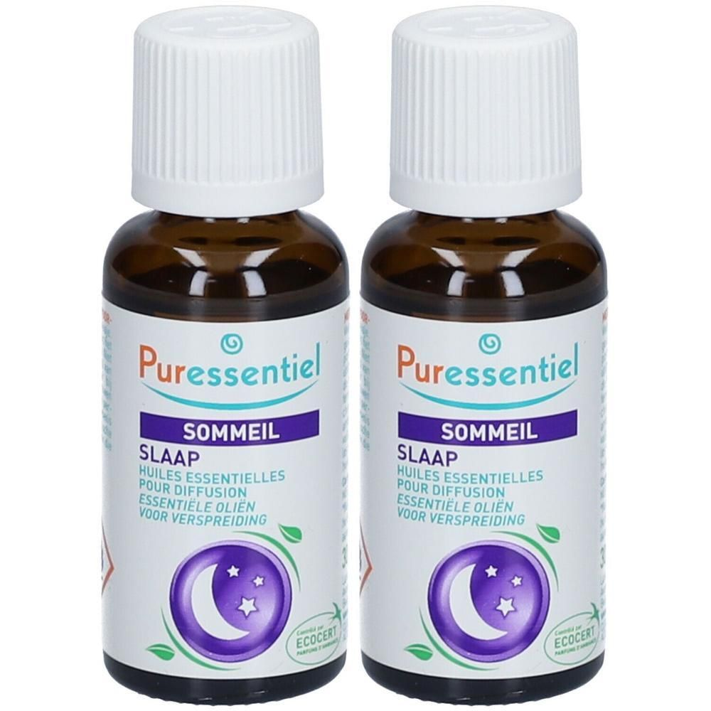 Twee bruine glazen flessen met witte doppen. Labels met "Puressentiel SOMMEIL" en "SLAAP". Maan- en sterrenlogo.