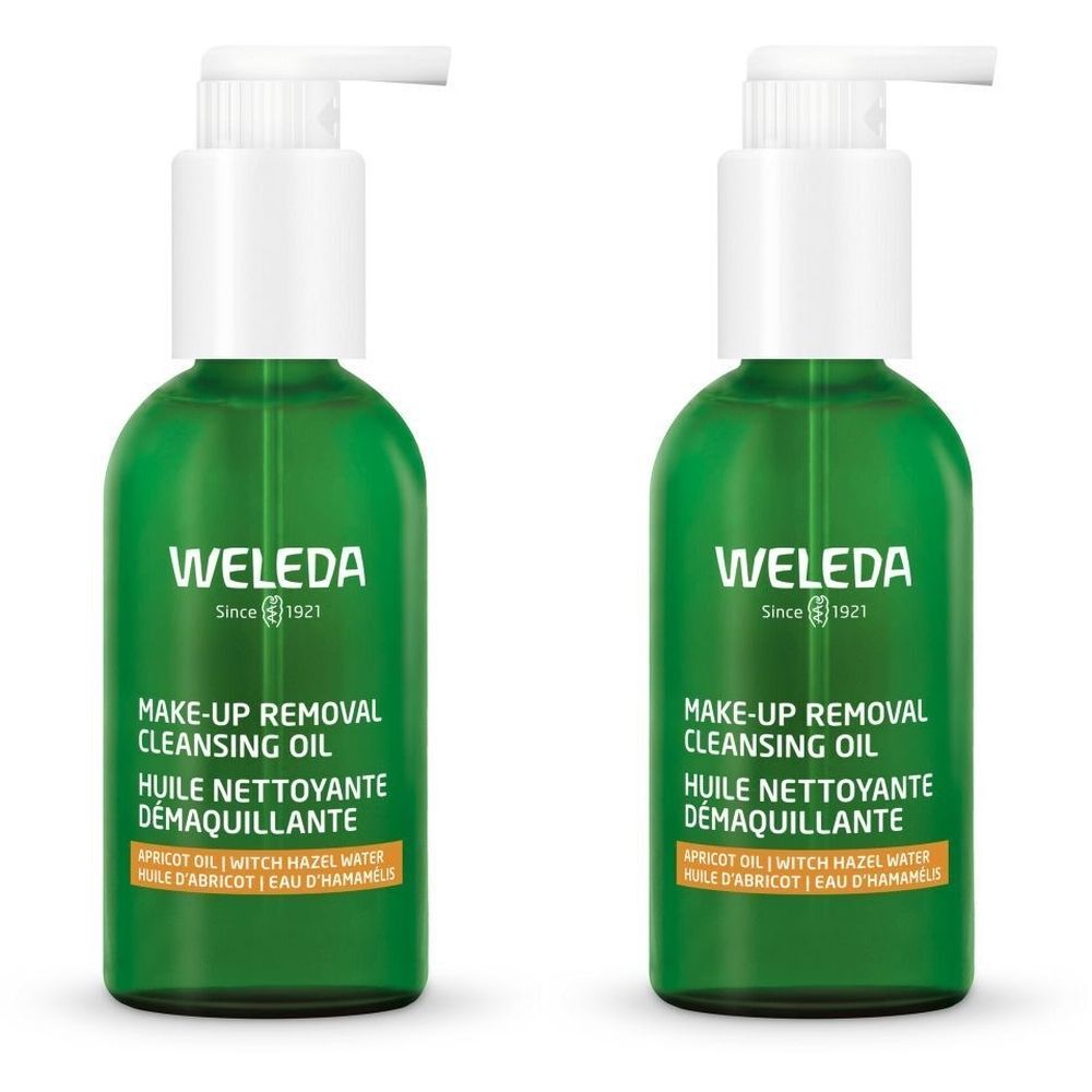 Twee groene flessen met witte pomp. Opschrift: WELEDA, Make-up Removal Cleansing Oil, Huile Nettoyante Démaquillante.