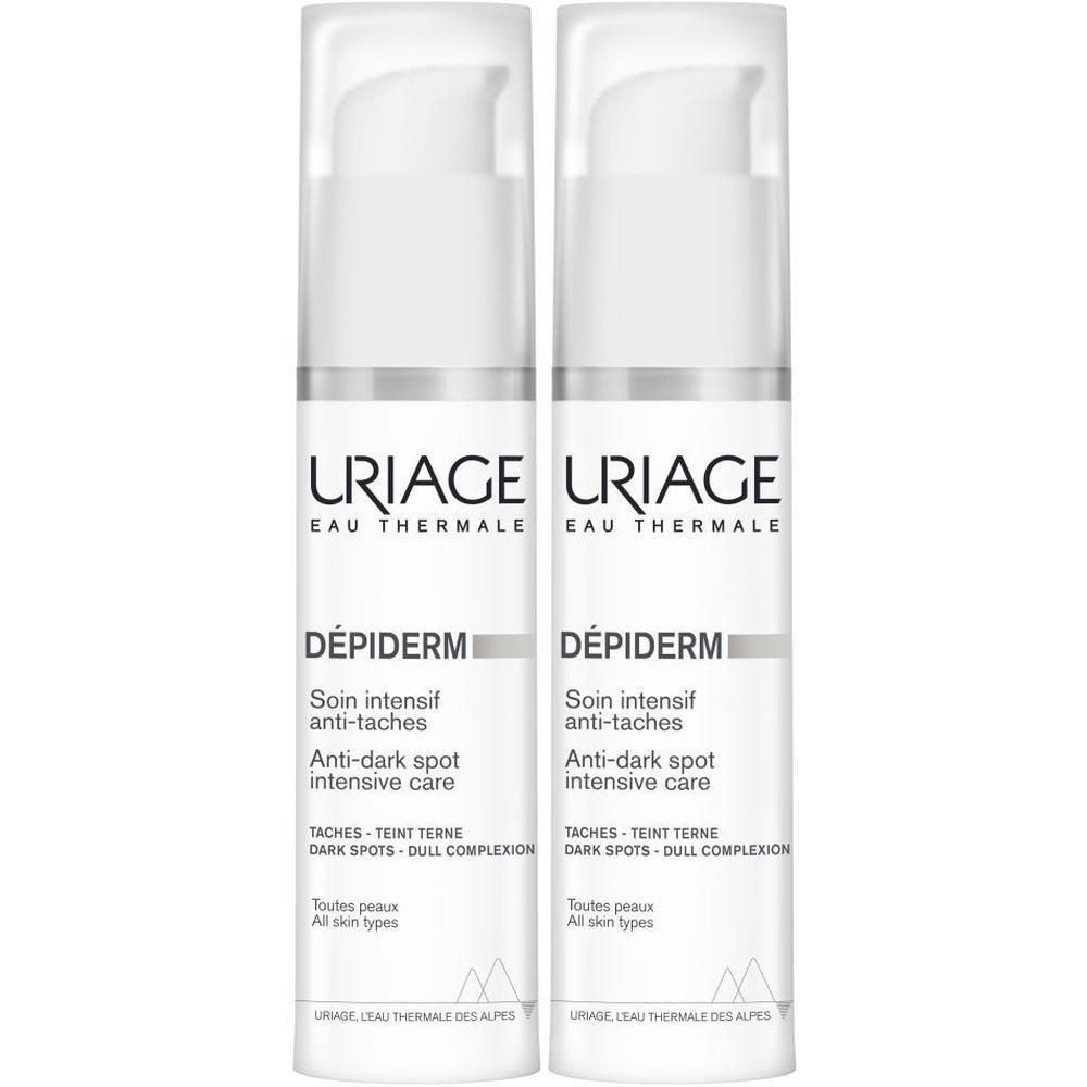 Twee witte flacons met pomp. Opschrift: Uriage, Dépiderm, Anti-Taches.