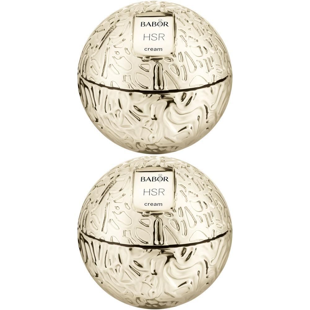 Twee goudkleurige crèmetiegels met de tekst Babor HSR cream. De potjes hebben een bolvorm met een reliëfpatroon.