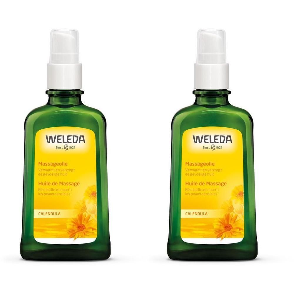 Deux flacons en verre vert avec vaporisateur blanc. Étiquette avec WELEDA, Huile de Massage, Calendula.