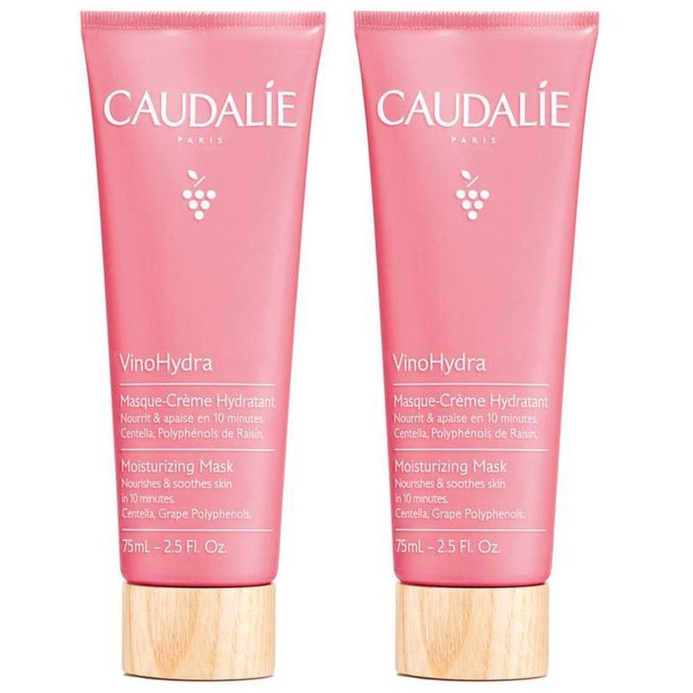 Deux tubes roses Caudalie Vinohydra Masque Crème Hydratant. Inscription: VinoHydra, Moisturizing Mask. Base couleur bois.