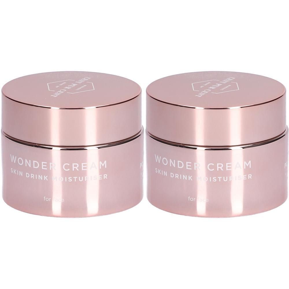 Twee roze potjes met deksels. Opschrift: Wonder Cream Skin Drink Moisturizer.