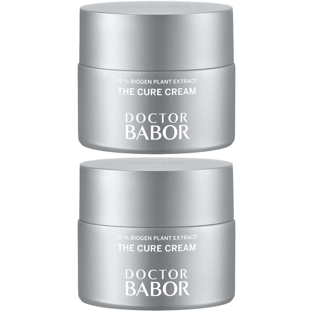 Twee zilverkleurige potten met de tekst THE CURE CREAM en DOCTOR BABOR.