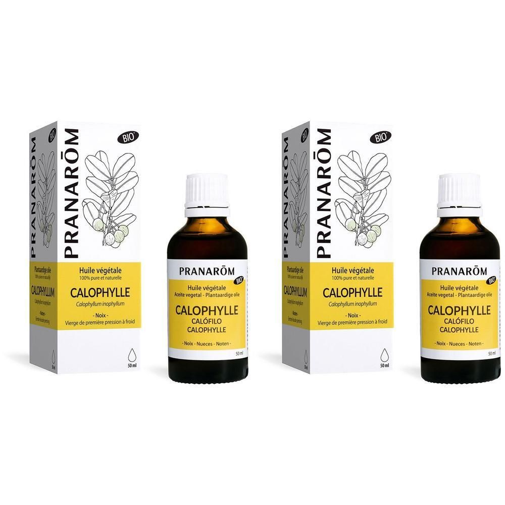 Deux flacons et emballages d'huile Pranarôm Calophylle Bio. Flacons avec étiquette jaune, emballage avec illustration végétale.