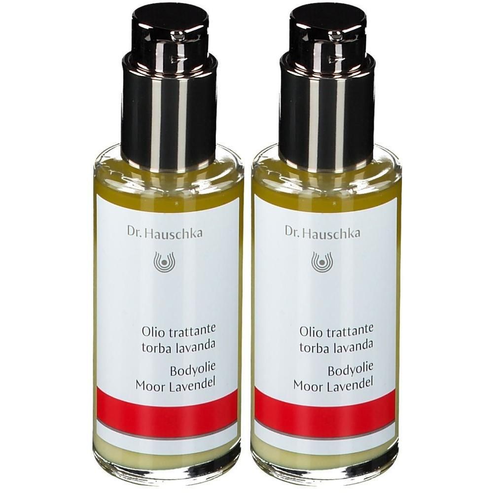 Twee glazen flessen met zwarte dop. De etiketten tonen "Dr. Hauschka", "Olio trattante torba lavanda" en "Bodyolie Moor Lavendel".