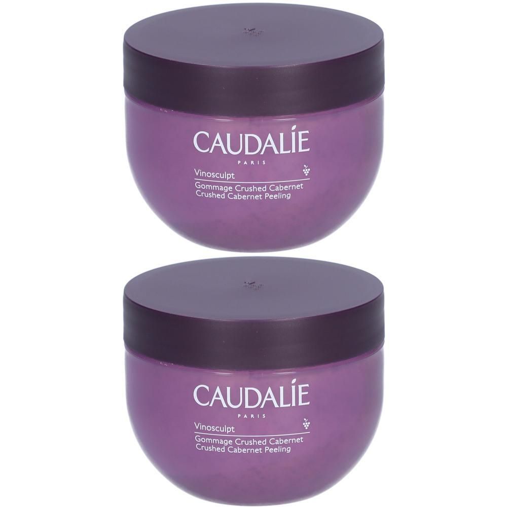 Deux pots violets avec couvercles. Inscription CAUDALIE, Vinosculpt, Gommage Crushed Cabernet, Crushed Cabernet Peeling.