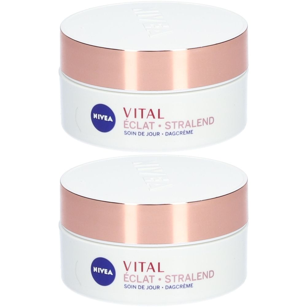 Twee potten Nivea Vital Éclat Soin de Jour. Witte potten met roségouden deksels. Opschrift: Vital Éclat Stralend, Soin de Jour, Dagcrème.