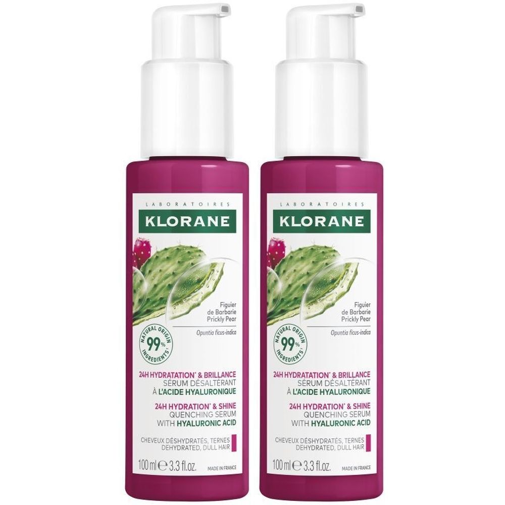 Twee flessen Klorane serum. Roze flessen met witte pomp. Etiket met logo, productnaam en informatie.