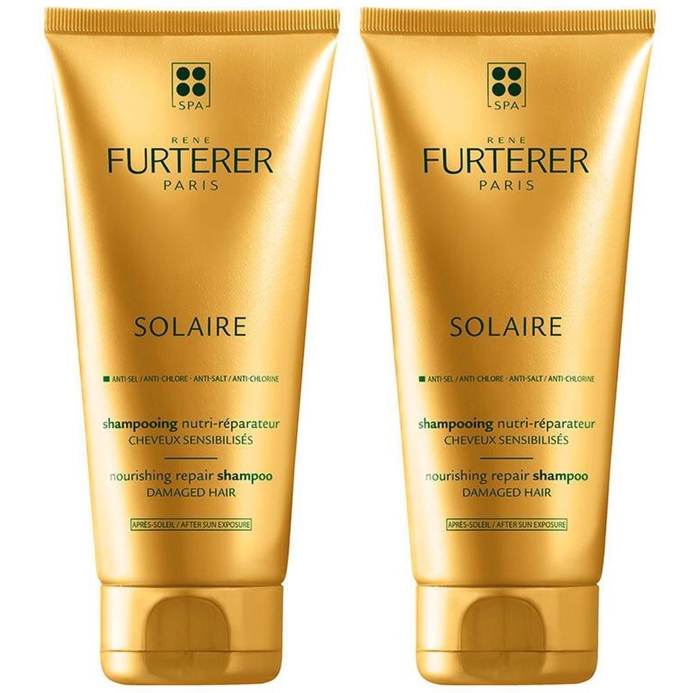 Twee gouden tubes. Opschrift: René Furterer Paris, Solaire, Shampooing Nutri-Réparateur, voor door de zon beschadigd haar.