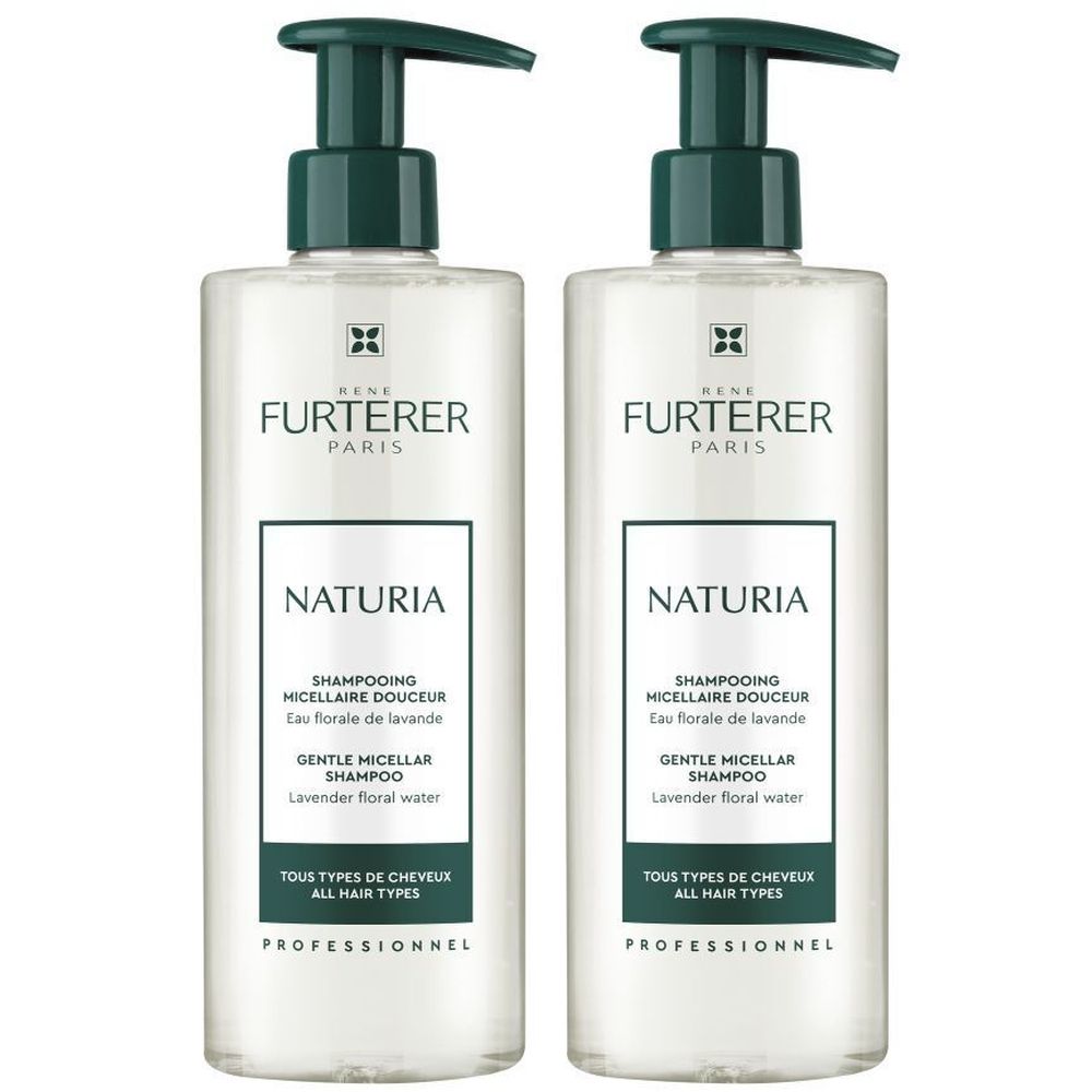 Twee flessen René Furterer Naturia shampoo. Transparante flessen met groene pomp. Opschrift Naturia en andere productinformatie.