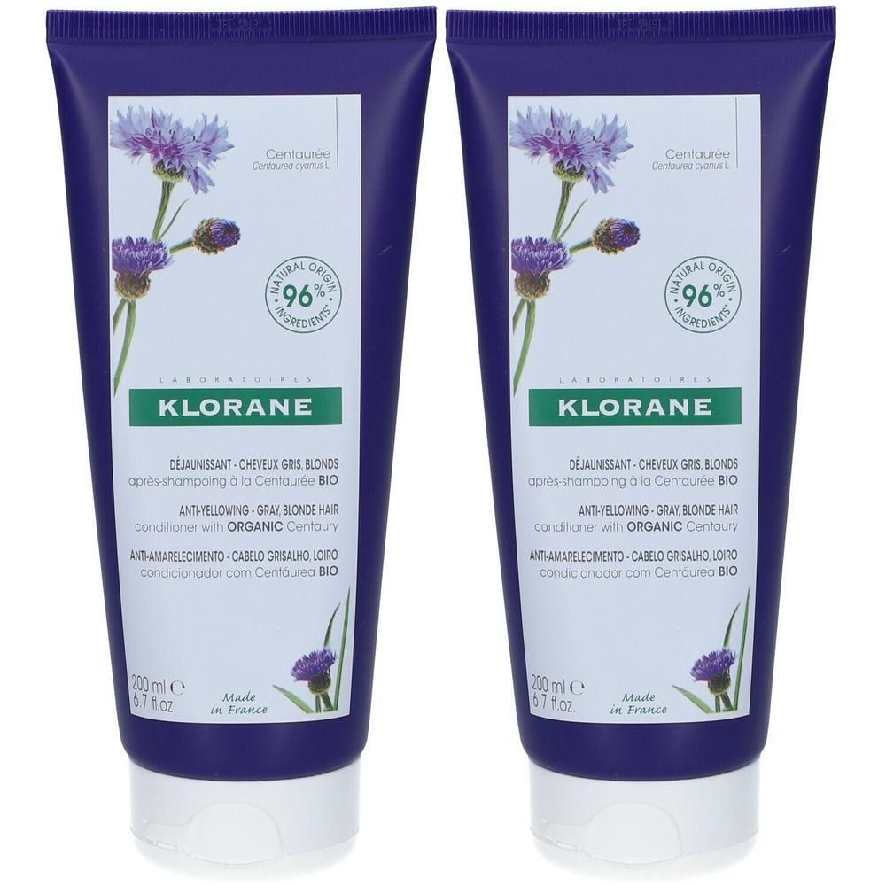 Deux tubes de revitalisant Klorane. Tubes bleus avec étiquette blanche. Inscription : Klorane, Déjaunissant, Cheveux Gris Blonds, 96% ingrédients d'origine naturelle.