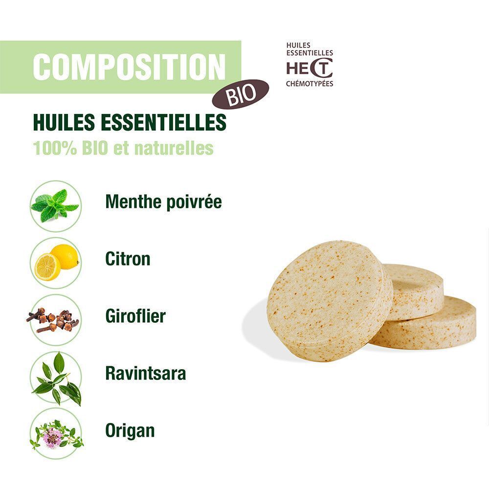 Gros plan sur les pastilles et les ingrédients. Visibles: menthe poivrée, citron, girofle, ravintsara, origan. Label Bio.