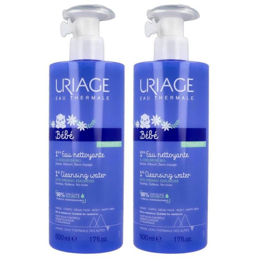 Deux flacons bleus avec pompe. Inscription: Uriage Bébé, 1ère Eau Nettoyante, 1 Cleansing water. Contenance 500ml.