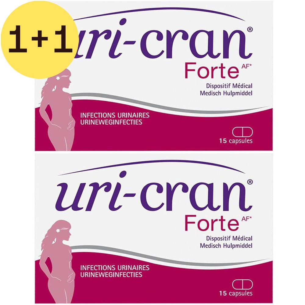 Twee verpakkingen Uri-Cran Forte. Opschrift: 1+1 GRATIS. Elke verpakking: 15 capsules, logo en tekst.