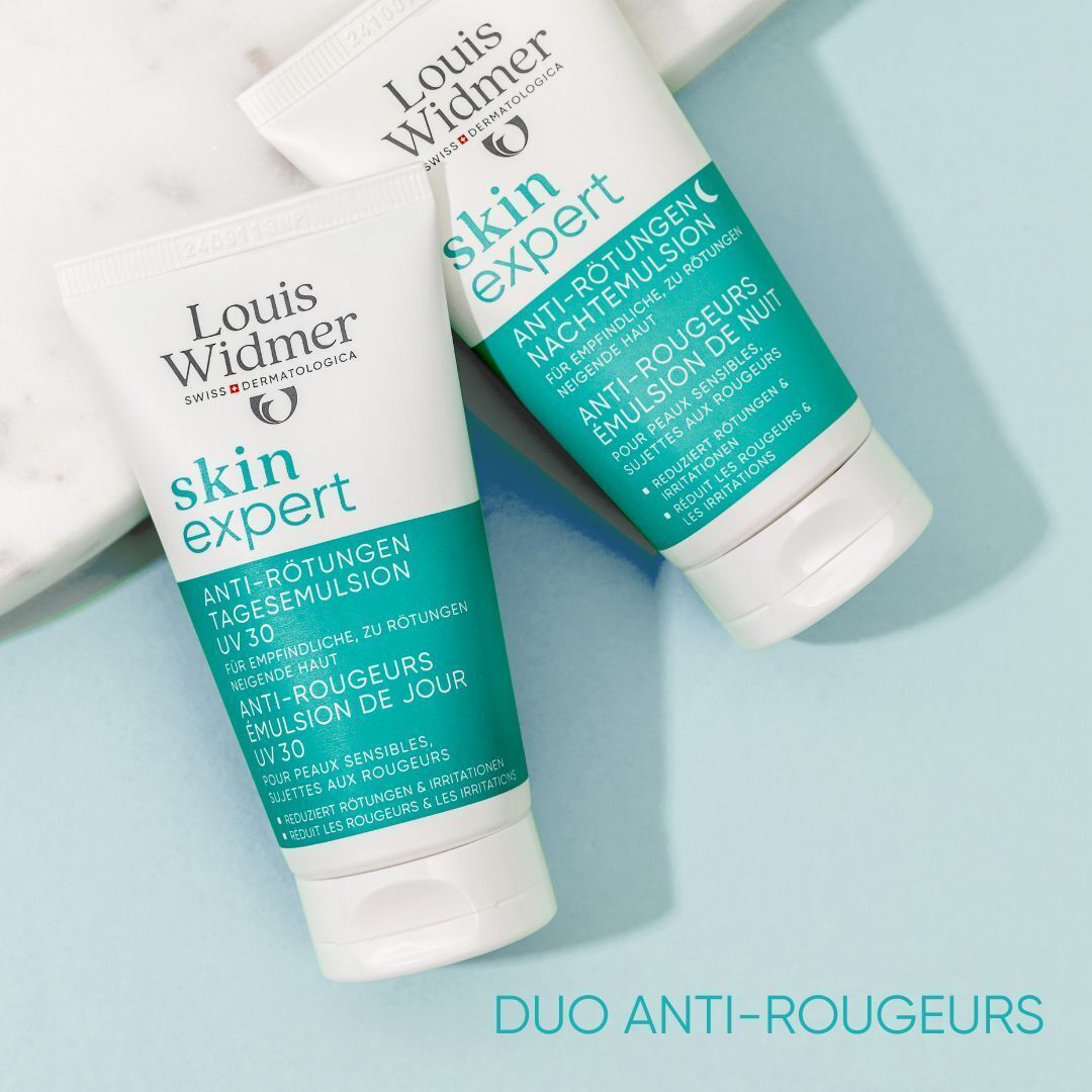 Deux tubes Louis Widmer Skin Expert. Une émulsion de jour Anti-Rougeurs UV 30, une émulsion de nuit Anti-Rougeurs. Tubes blancs avec texte vert.