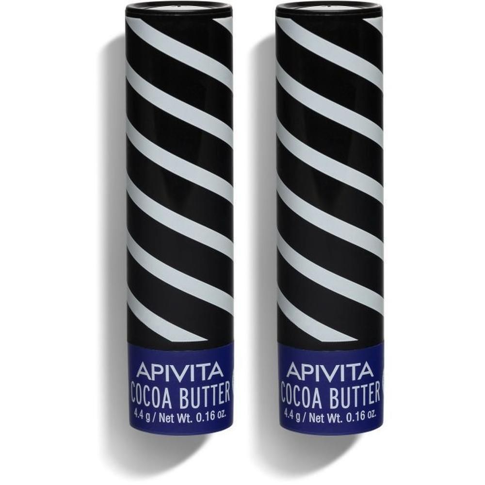 Deux sticks à lèvres Apivita. Motif noir et blanc rayé. Base bleue avec texte.