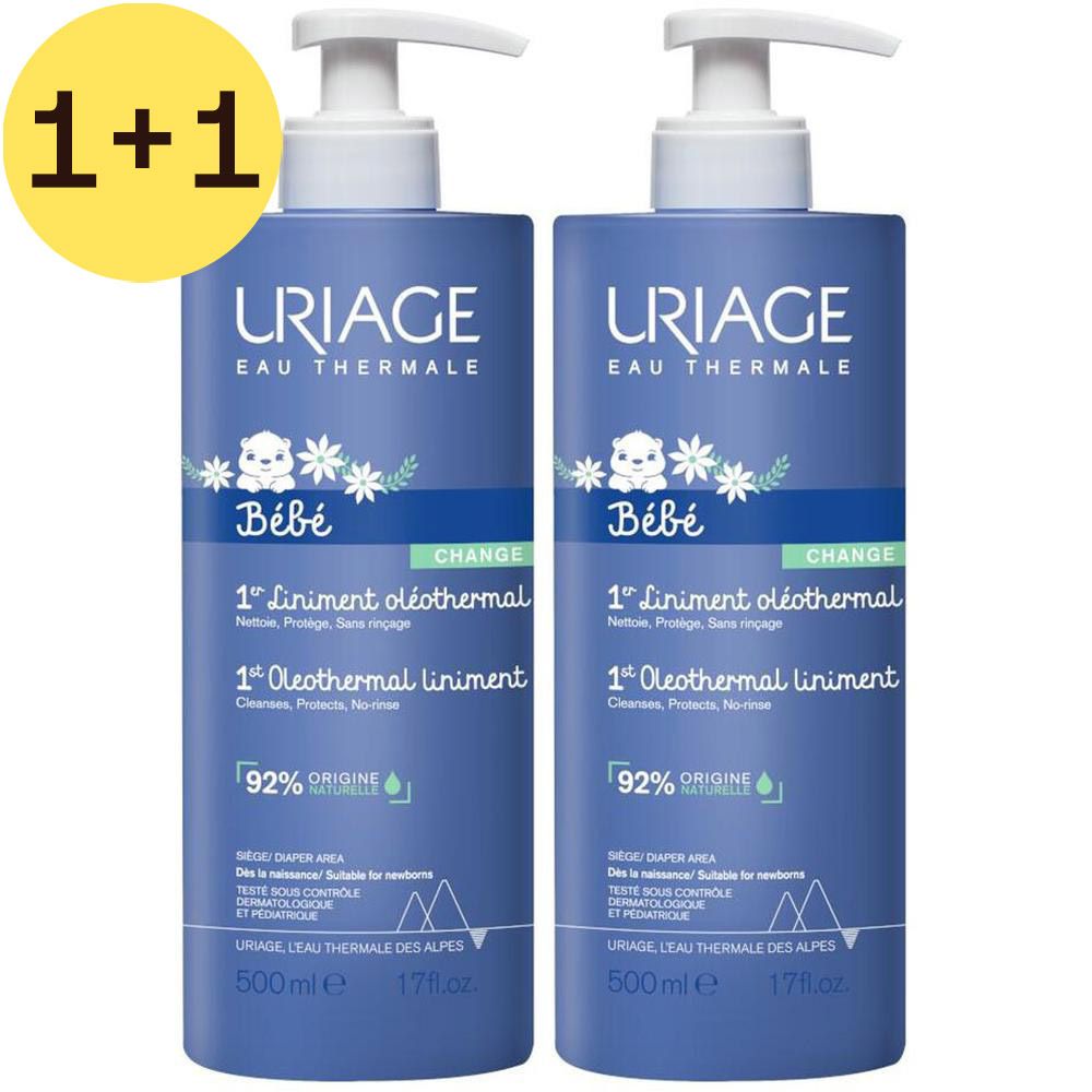 Twee blauwe flessen met witte pomp. Opschrift: Uriage Bébé, 1er Liniment Oléothermal, 500ml.