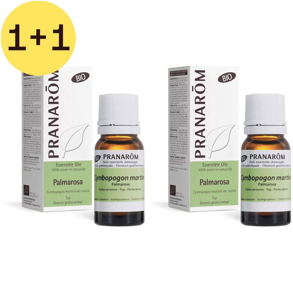 Twee flessen en dozen Pranarôm Palmarosa Bio. Bruine glazen flessen met witte doppen. Witte dozen met groene accenten.