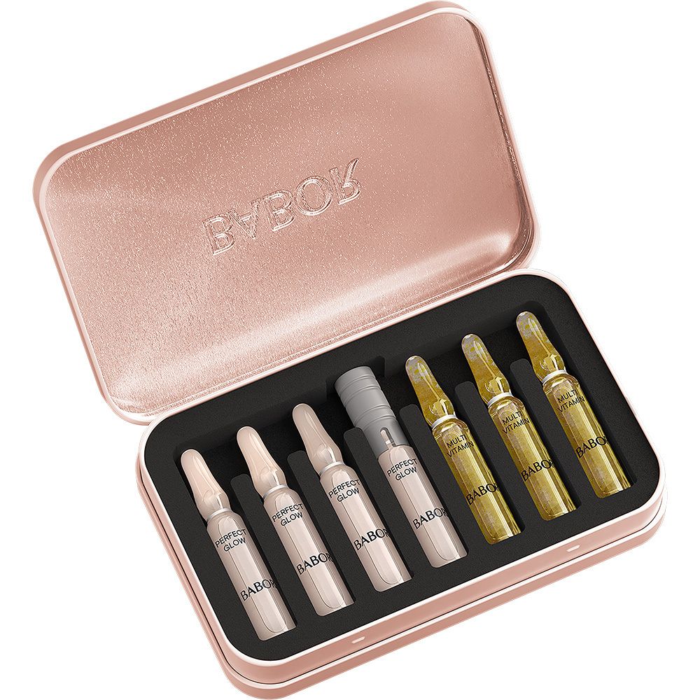 Boîte métallique rose ouverte avec 6 ampoules. Ampoules en deux couleurs. Marque : Babor.