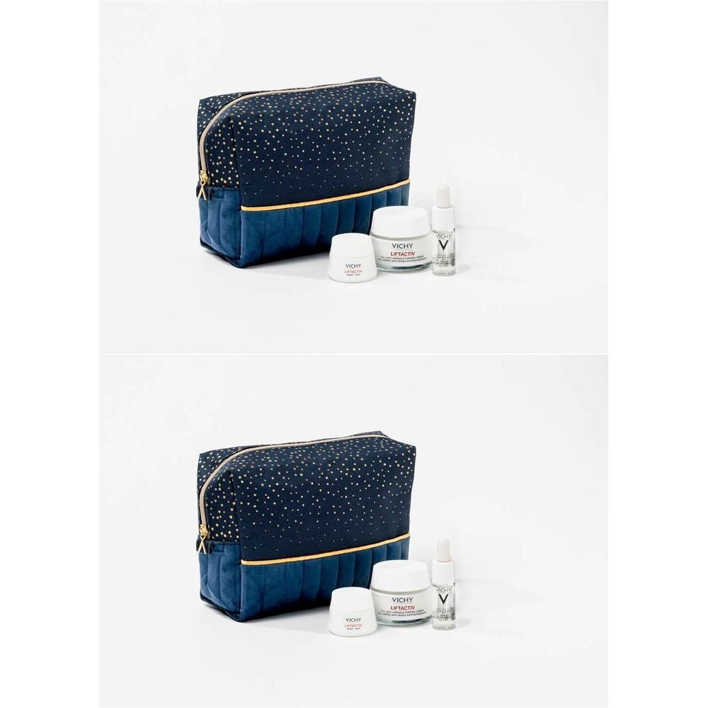 Make-uptas met producten. Donkerblauwe tas met gouden stippen en ritssluiting. Bevat crèmes en sprays. Vichy-logo zichtbaar.