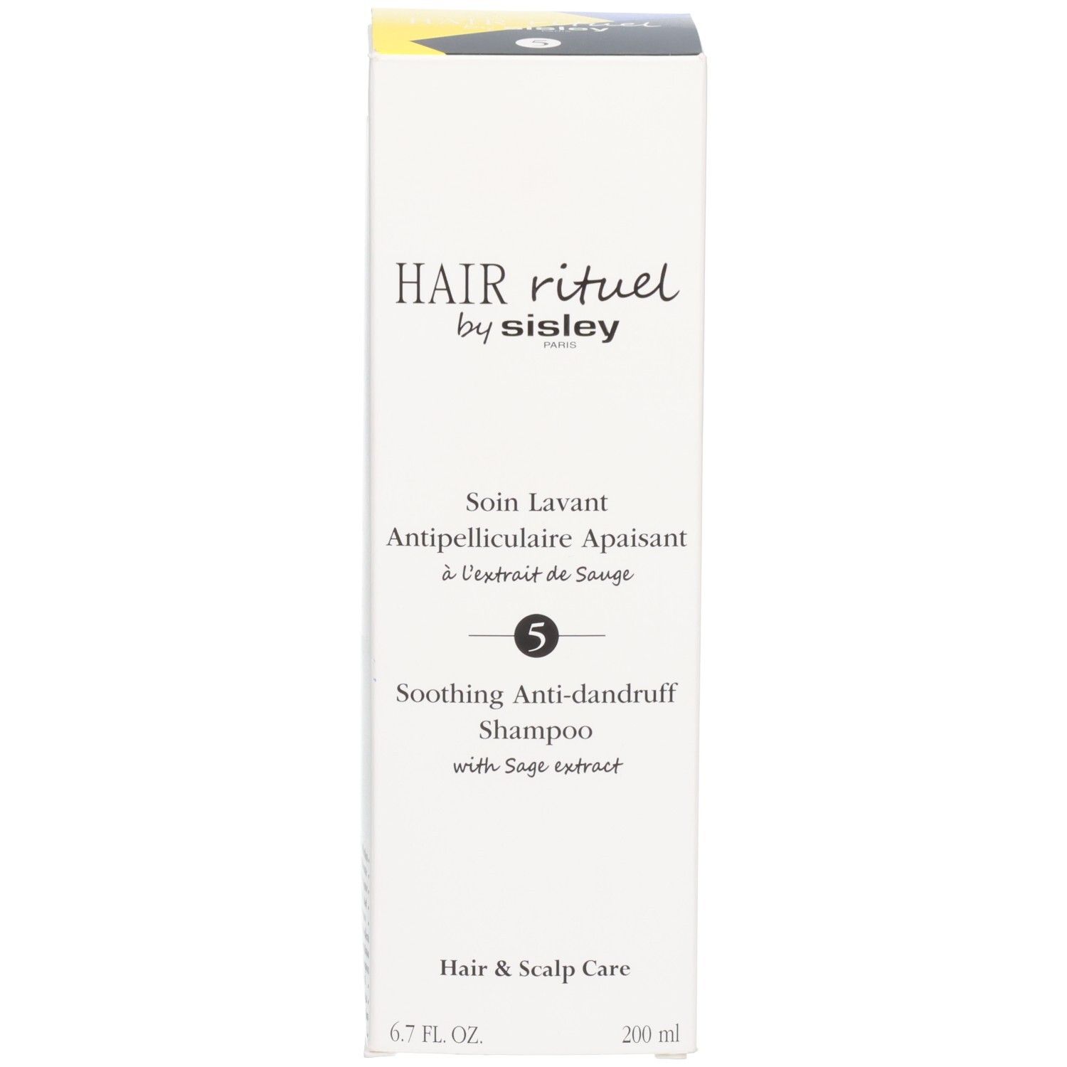 Verpakking van Hair Rituel by Sisley kalmerende anti-roos shampoo.