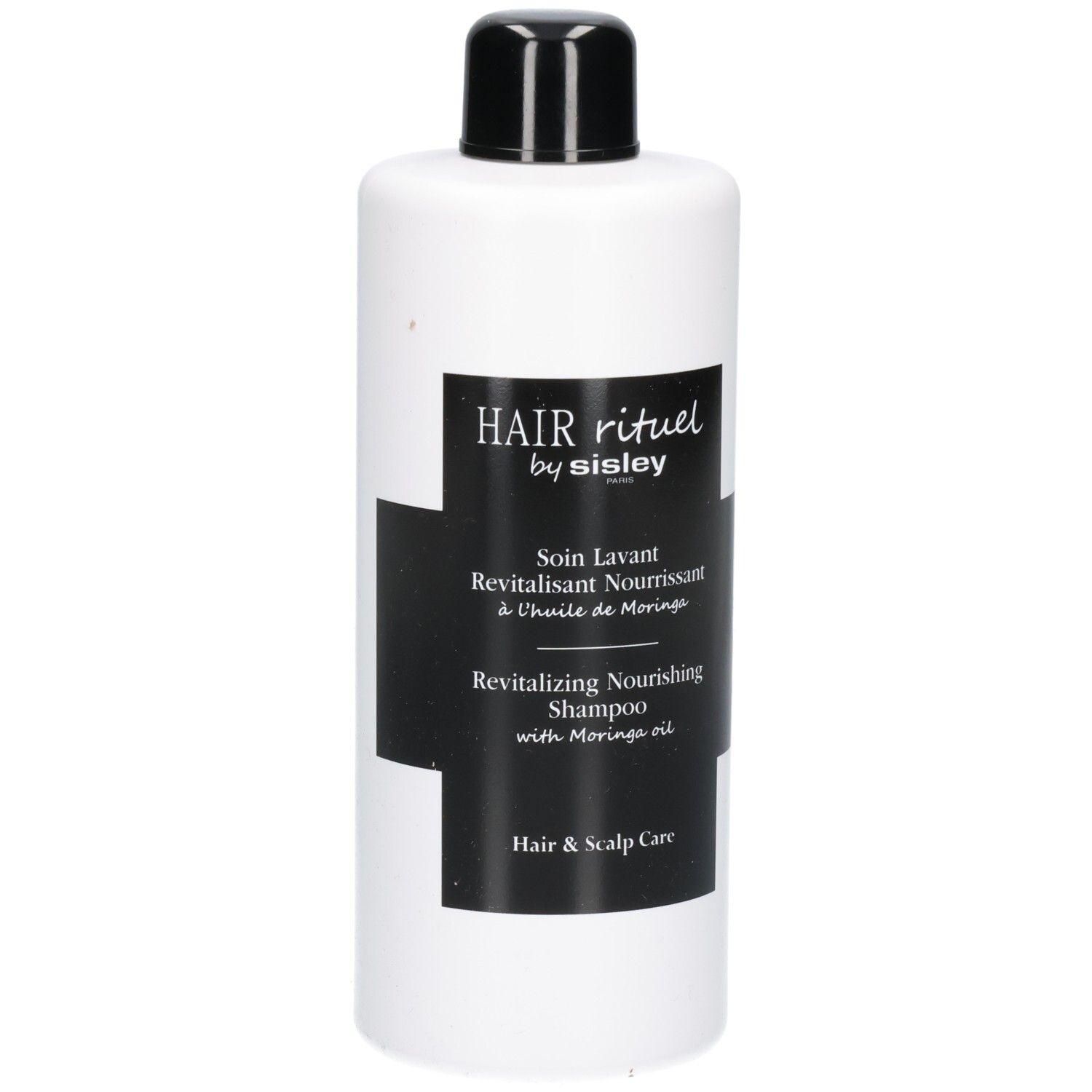 Witte fles met zwart etiket: Revitalizing Nourishing Shampoo.