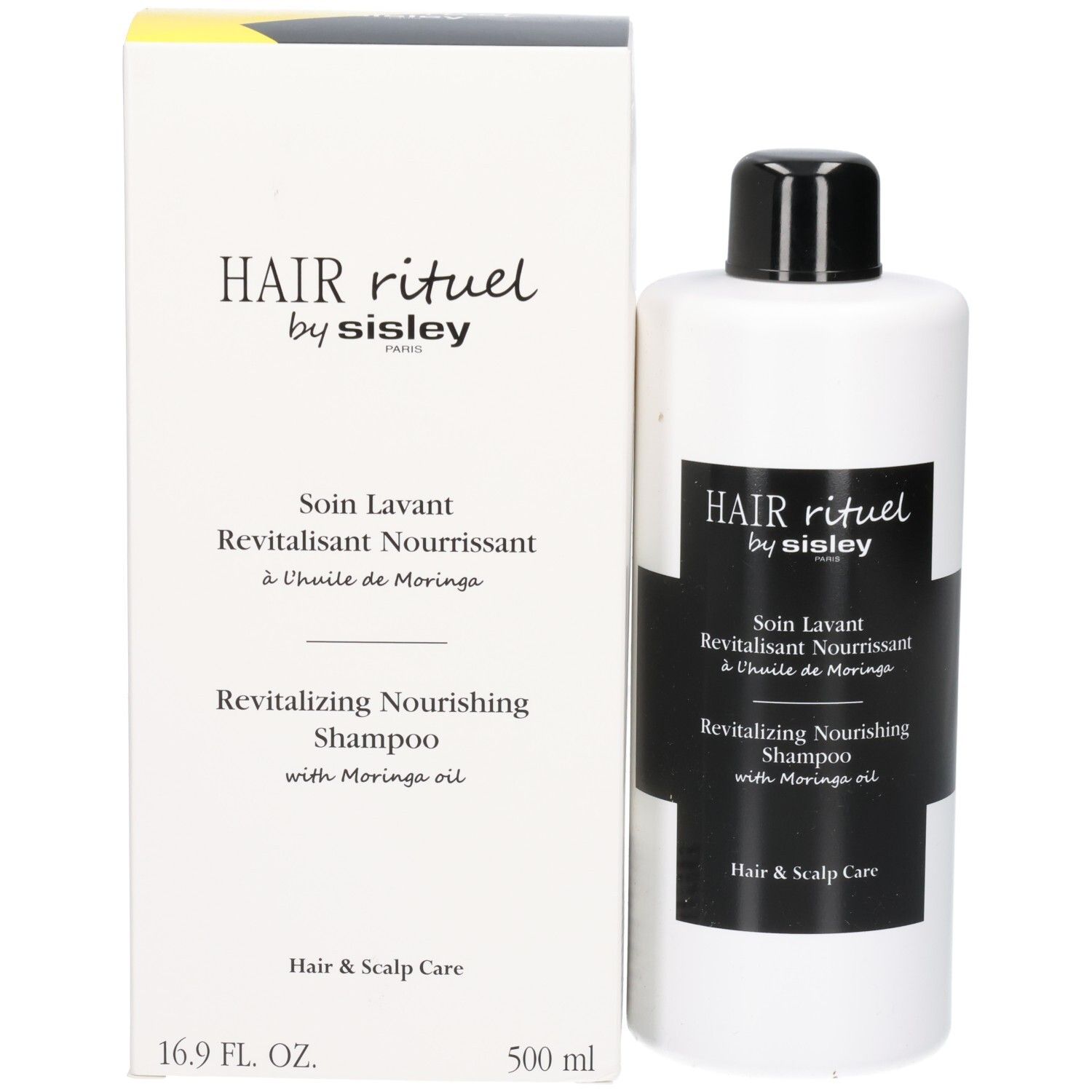 Witte fles en doos met zwart etiket: Revitalizing Nourishing Shampoo.