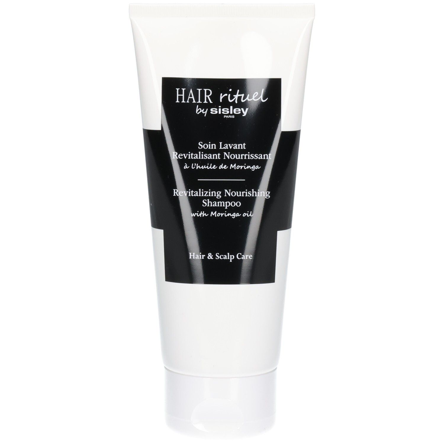 Tube met Revitalizing Nourishing Shampoo van Hair Rituel by Sisley.
