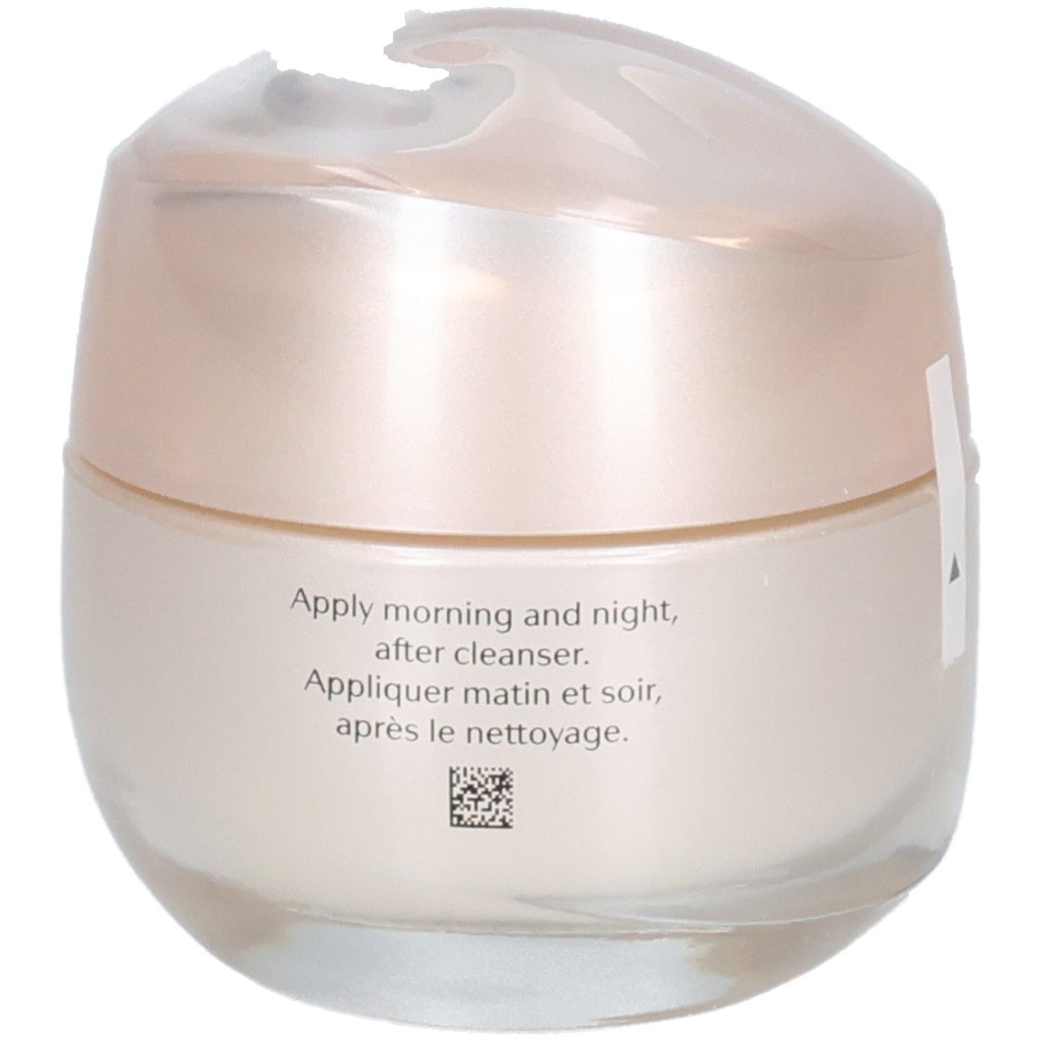 Ronde pot met crème-kleurige cosmetica en parelmoerkleurig deksel.