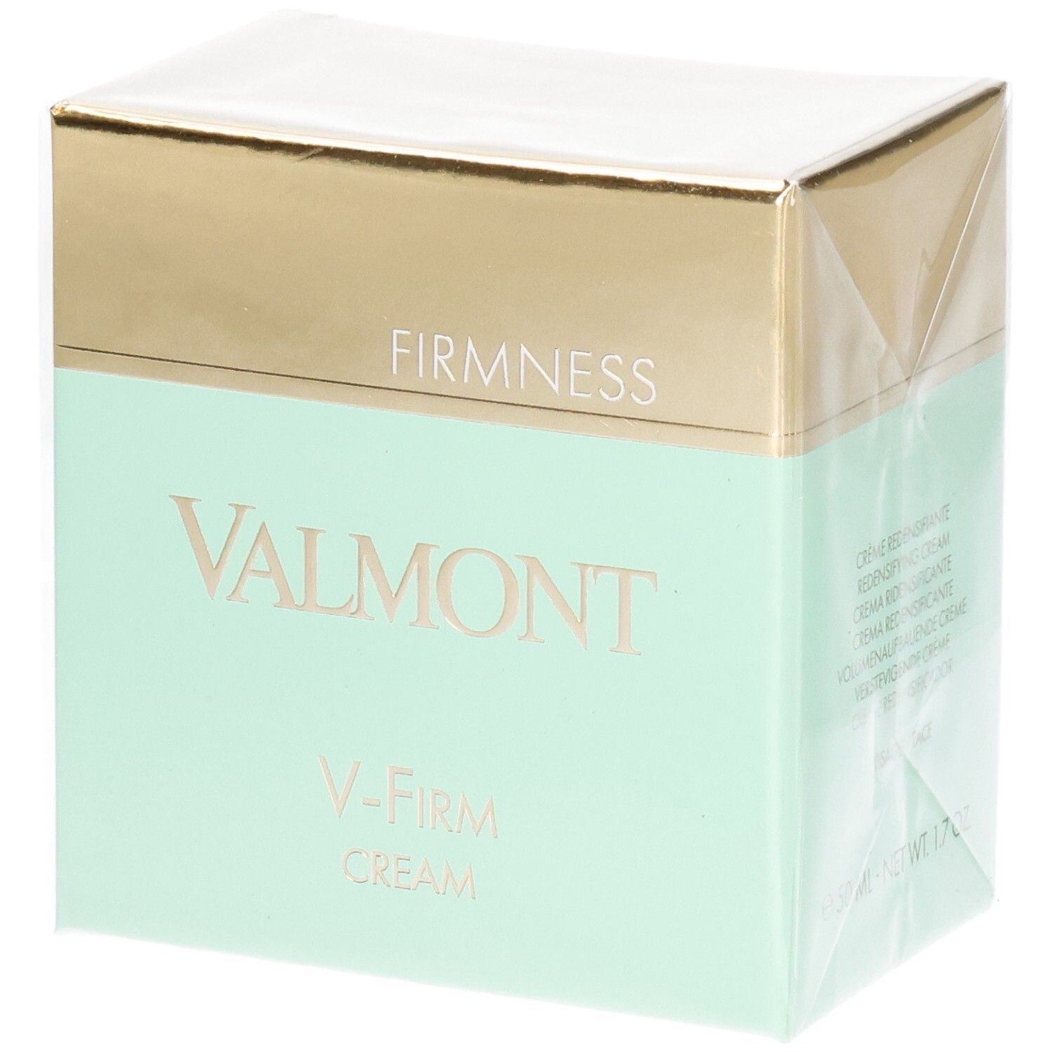 Valmont V-Firm Cream verpakking met gouden en mintgroene band. "FIRM NESS" en "VALMONT" zijn op de voorkant gedrukt.