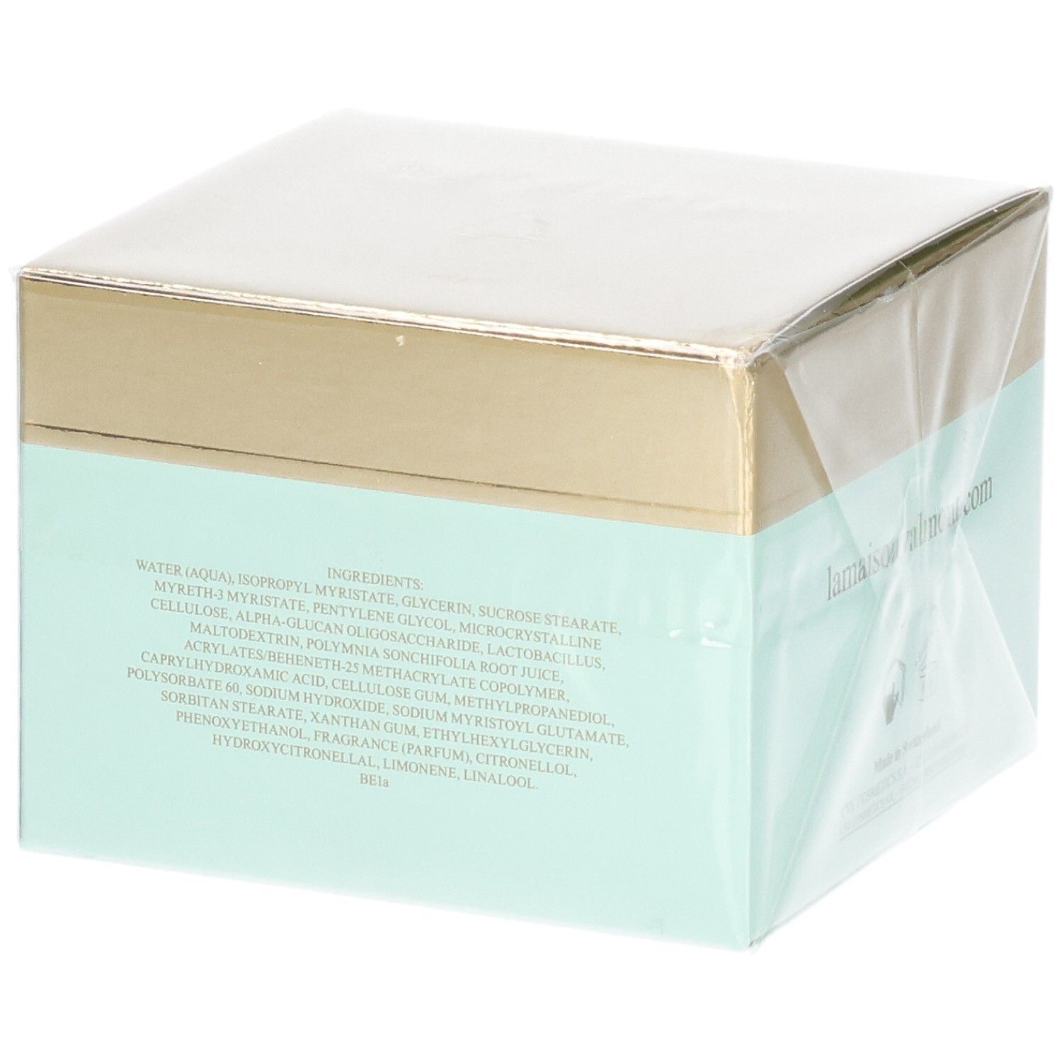 Achterkant van de VALMONT Wonder Falls Purity verpakking met ingrediëntenlijst. Gouden en mintgroene doos.