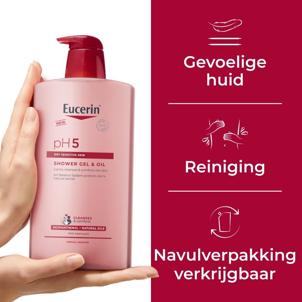 Hand houdt Eucerin pH5 Douchegel-Olie vast. Kenmerken: gevoelige huid, reiniging, navulling. Nederlandse tekst.