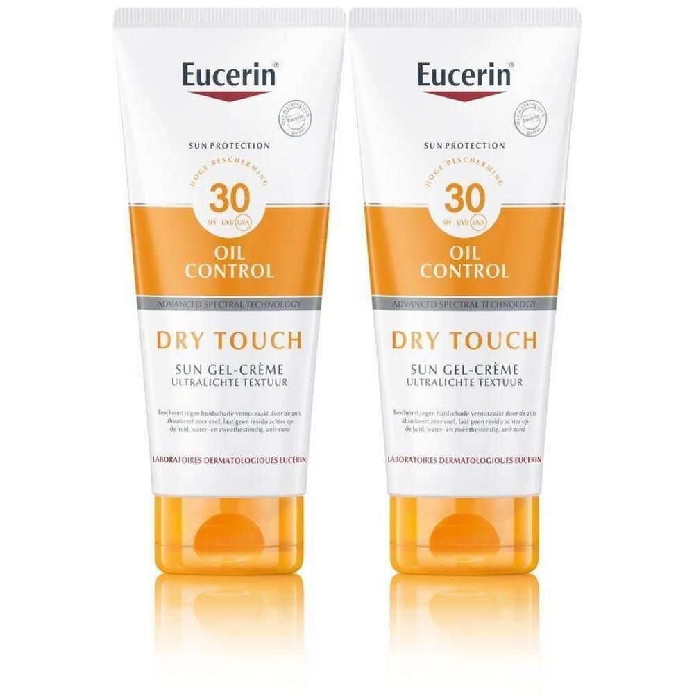 Twee tubes Eucerin Dry Touch Sun Gel-Crème. Wit, oranje en geel. Tekst: 30, OIL CONTROL, DRY TOUCH, Ultra-Lichtgewicht Textuur.