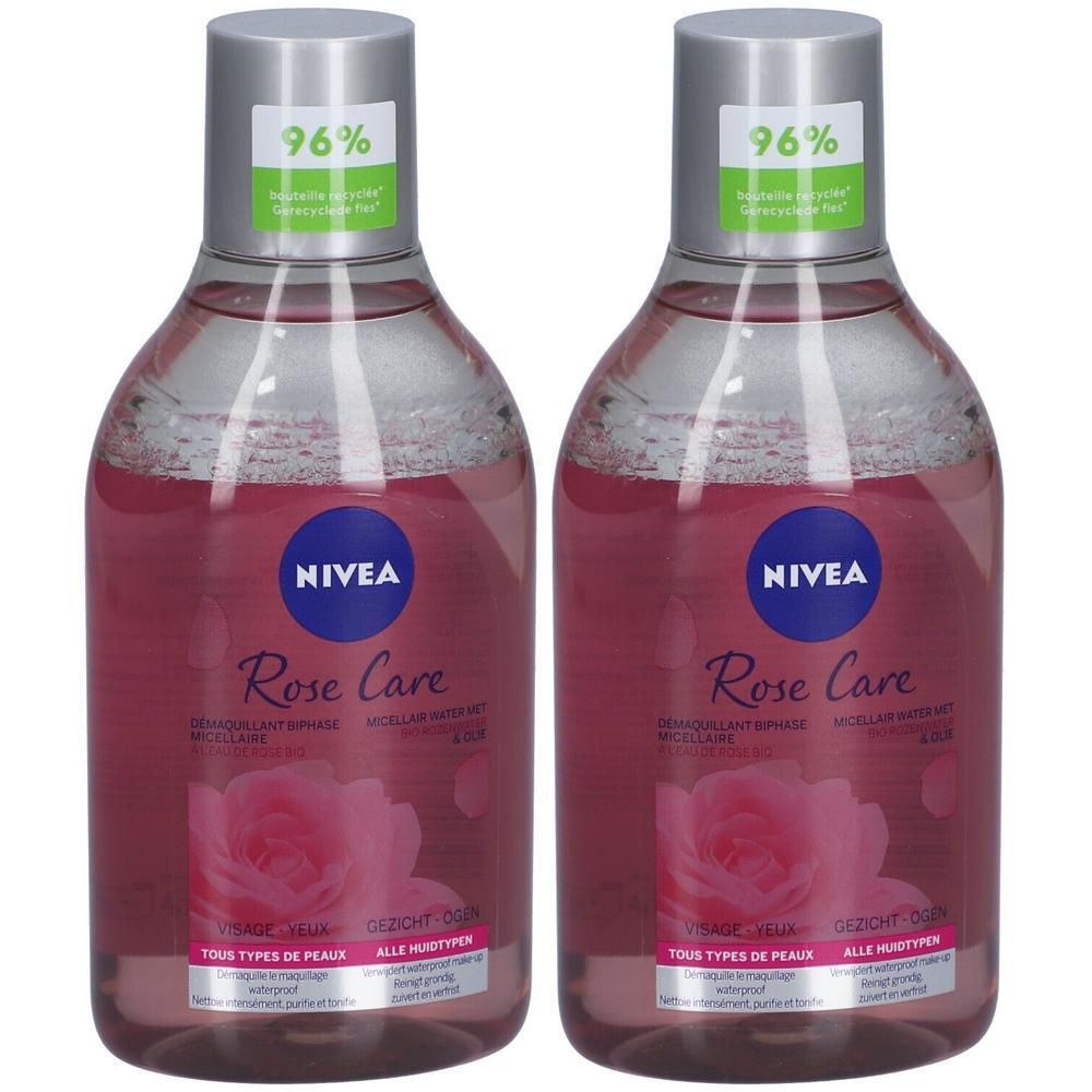 Deux flacons de Nivea Rose Care. Liquide rose, bouchon argenté, étiquettes bleues avec texte et motif de rose. Pour tous types de peau.