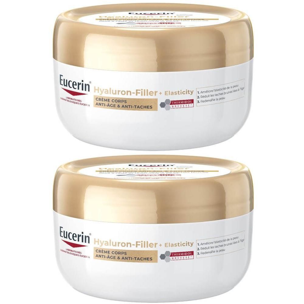 Deux pots de crème Corps Anti-Âge & Anti-Taches. Couvercle doré, contenant blanc. Eucerin Hyaluron-Filler + Elasticity.