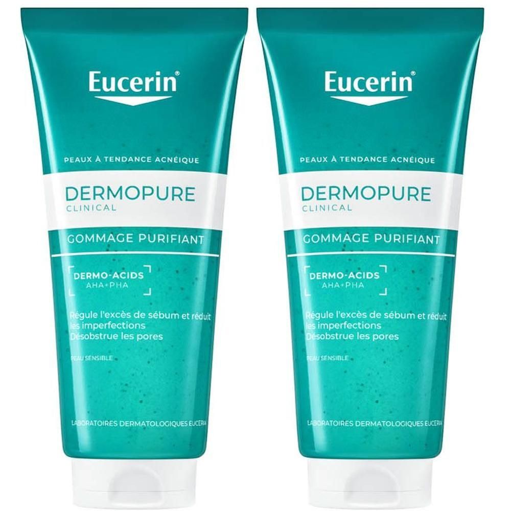 Deux tubes de Gommage Purifiant Visage Eucerin DERMOPURE CLINICAL. Emballage vert et blanc, marque visible.