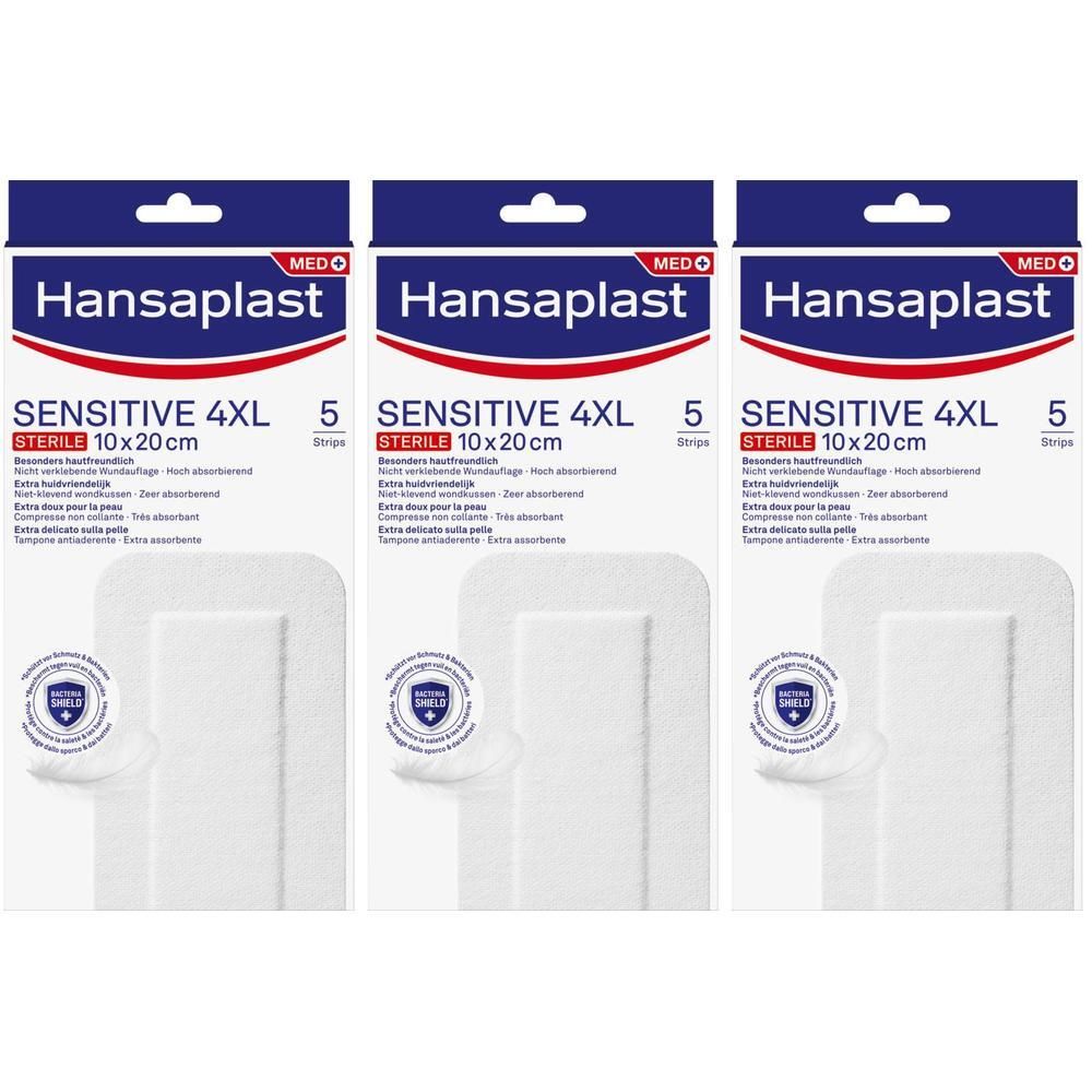 Drie verpakkingen Hansaplast Sensitive 4XL steriele pleisters. Elke verpakking bevat 5 pleisters. Afmeting 10x20cm.
