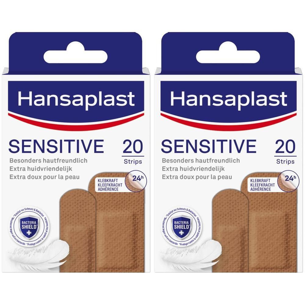 Twee verpakkingen Hansaplast Sensitive pleisters. Opschrift: Sensitive, 20 strips. Extra doux pour la peau. Kleefkracht 24h.