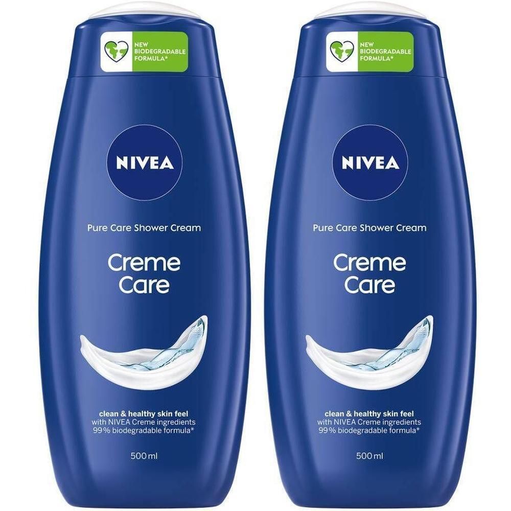Deux flacons bleus de crème de douche. Inscription : Nivea, Creme Care. Formule biodégradable à 99 %. 500 ml.