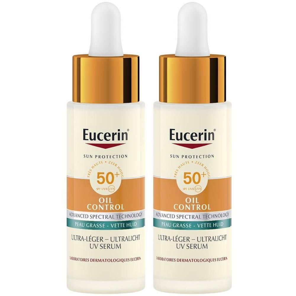 Twee flacons Eucerin Sun Oil Control Serum SPF50+. Witte flacons met gouden doppen en pipetten.