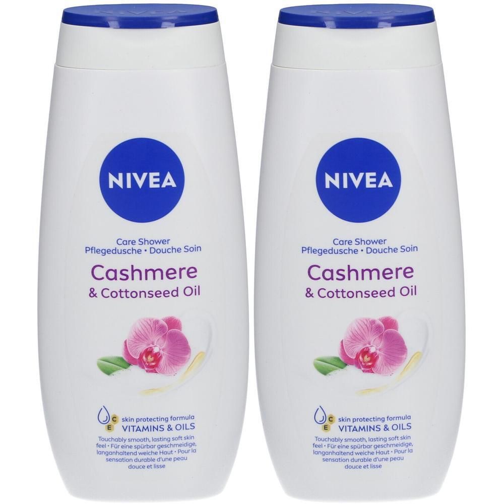 Twee witte NIVEA douchegels met blauwe dop. Opschrift: Cashmere & Cottonseed Oil. Met afbeelding van orchidee.