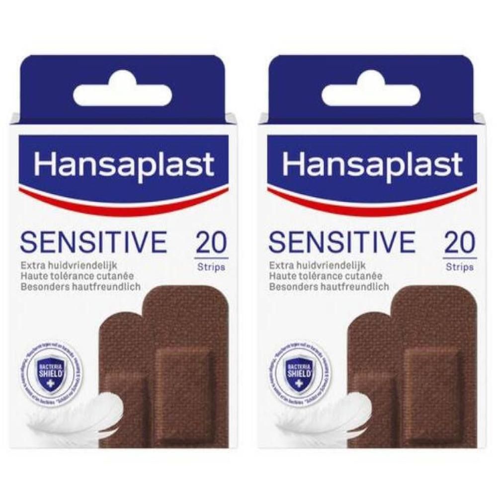 Deux boîtes de pansements Hansaplast Sensitive. Inscription : Sensitive, 20 Strips. Pansements bruns représentés.